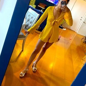 Yellow romper from revolve brand by the way